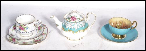 A group of ceramics to include a Royal Albert Enchantment tea pot a Petit Point tea cup saucer and