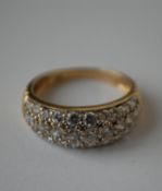 A hallmarked 9ct gold ring having pave set CZ dome. Hallmarked Sheffield. Size L.  Weight 2.6g.