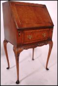 A mid century Queen Anne revival burr walnut ladies writing bureau. Raised on cabriole legs with
