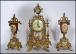 A 19th century German Continental clock and garniture set. The garnature's being of urn form with