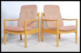 A pair of 20th century Ercol staff chairs. Light b