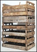 A collection of mid century large apple crates of slatted wood construction having various