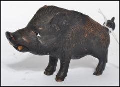 A 19th century Victorian black-forest carved novelty inkwell in the form of a boar with painted eyes