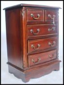 A 20th century antique style mahogany bachelors chest of drawers. Of small proportions raised on