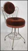 A retro vintage 20th century bedroom boudoir wire work dressing table chair having a scroll work