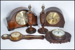 Two vintage early 20th century wooden cased mantel clock along with two vintage barometers and a