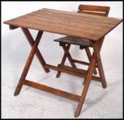 A retro 1970's child's camping teak slatted folding table / desk with matching chair. Measures