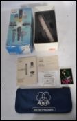 An AKG C1000s stage and studio condenser microphone complete in the original box.
