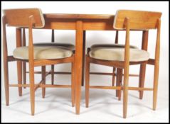 G plan - Fresco range - A 1960's teak extending round table together with a set of four chairs