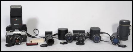 A vintage SLR Fujica ST901 Auto Electro camera with 55mm lens. Together with a 35mm Optomax lens