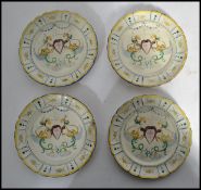 A collection of 4 believed 19th century Faience ware plates decorated with blue and yellow geometric