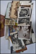 Postcards; a collection of assorted early 20th century postcards to include real photo, artist