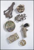 A group of vintage jewellery to include to include a silver white metal double dragon crown brooch a