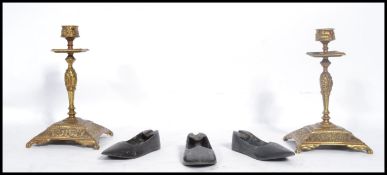 A pair of 19th century brass ecclesiastical candlesticks, each with single sconces together with a