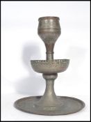 An 18th century Damascan / Indian temple copper oil lamp. The sectional lamp having a pieced edge