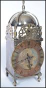 An early 20th century silver plated Buren lantern clock having a Roman numeral chapter ring with