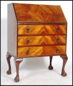 A vintage 20th century mahogany bureau, fall front with fully appointed interior together with a