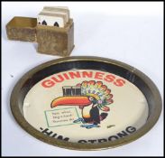 A rare early 20th century Guinness cased set of playing cards. Red and black set also with a