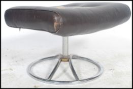 A retro mid century, circa 1970's leather and chrome footstool / ottoman. Raised on tubular chrome