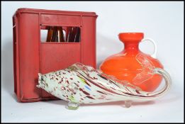 A retro mid century orange glass squat ewer jug vase together with a Murano glass fish and a red