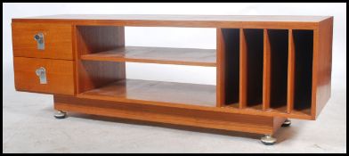 A 1970's teak wood Danish influence low sideboard / side cabinet. Raised on chrome and teak wood