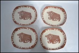 A set of four vintage 20th century retro Beef-eater plates with a brown cow on each. Marks stamped