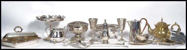 A collection of vintage 20th century silver plated items to include a sugar shaker, warming