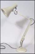 A vintage 20th century retro Herbert Terry 90 anglepoise desk lamp in white with circular base and