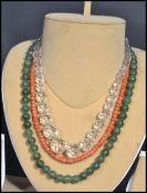 Three vintage 20th century bead necklaces to include a jade example with silver clasp , faceted