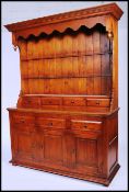 An excellent large hardwood / oak country dresser of impressive size having a wonderul overhanging
