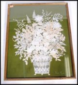 A mid century hand embroidered lace work panel of  chrysanthemums  in basket by Joan Payne being set