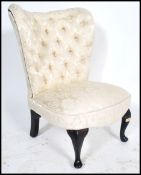 A 20th century  ebonised balloon back Victorian style nursing chair with button back upholstery