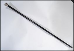 An early 20th century silver hallmarked topped promenade cane walking stick having a tapering