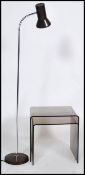 A graduating pair of vintage 20th century acrylic tables along with a floor standing anglepoise lamp