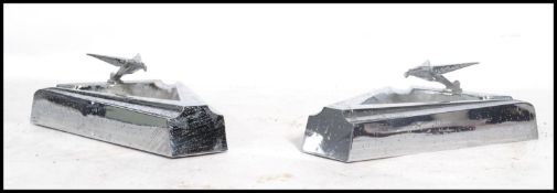 A pair of 1930's American Art Deco chrome ashtrays of angular form with eagle adorned tops. Each