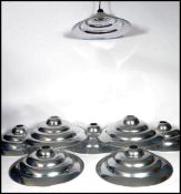 A set of eight vintage 20th century retro ' Space Age ' chrome ceiling pendant UFO type light shades