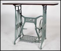 A good 19th century up cycled sewing machine table. Cast iron base with makers name Haid & Neu.