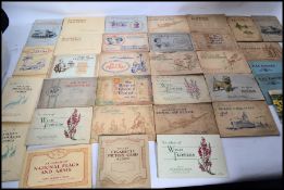 A large collection of assorted cigarette cards - large quantity of loose, and some in albums.