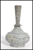 A 19th century Middle Eastern Bronze Mesopotamia baluster vase. The globular body decorated in