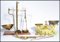 A group of vintage weighing scales and weights to include a set of of miniature bell weights , a