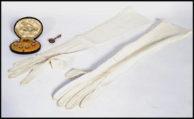 A vintage 20th century cased set of Edwardian gents dress buttons together with a silver