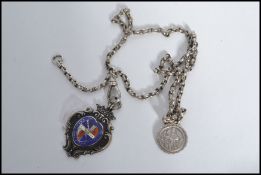 A vintage 20th century silver hallmarked fob medal on a silver chain. The fob medal having