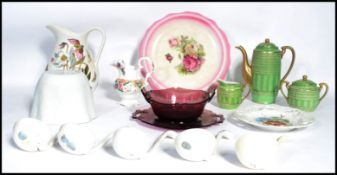 A collection of vintage ceramics to include 19th century ceramic ladles, cranberry glass dish and