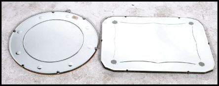 Two Early 20th century Art Deco cut and etched glass mirrors. One round and the other rectangular.