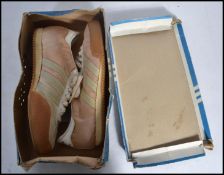 A pair of boxed unused Adidas squash trainers from the 1970's. Endorsed by Jonah Barrington, also