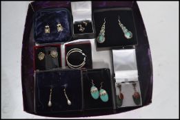 A group of eight pairs of silver earrings to include carnelian pair , turquoise pair , pearl pair