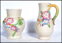 A Clarice Cliff early 20th century ewer / jug with floral vine and spray handle in the ' My Garden '