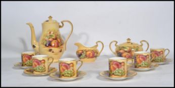 An Aynsley Orchard Rose tea service consisting of tea pot , lidded sugar bowl , creamer milk jug six