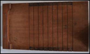 A vintage early 20th century Edwardian Shove Half Penny Board of typical form having ribbed board