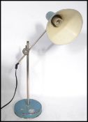 A 1970's Scandinavian vintage industrial teal and chrome desk lamp having a conical two-tone shade